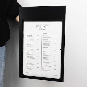Black rectangular wall menu board featuring a white printed food and beverage list. Minimalist metal restaurant signage for coffee shops, breakfast cafes, bistros and modern hospitality interiors.