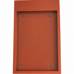 Orange Menu Frame 
Burnt orange metal menu display frame with a recessed rectangular center and four visible mounting points. Custom color wall menu box for modern restaurant interiors, coffee shops and hospitality display applications.