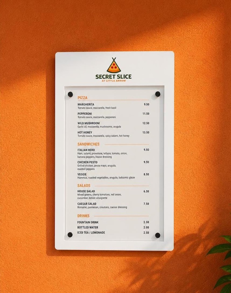 White wall mounted restaurant menu board displaying pizza, sandwiches, salads and beverages. Minimalist acrylic front menu holder for pizzerias, takeaway restaurants, casual dining spaces and food service counters.