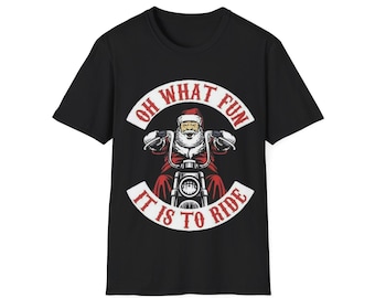 May include: Black t-shirt featuring a graphic of Santa Claus riding a motorcycle. Santa is wearing a red suit and hat, with a white beard. The text "OH WHAT FUN IT IS TO RIDE" is in a white banner.