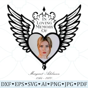 May include: A memorial design featuring a heart-shaped frame with a woman's portrait, adorned with stylized wings and the text "IN LOVING MEMORY OF." Below, the name "Margaret Adelman" and dates "1864-1970" are displayed. The design is in black and white.