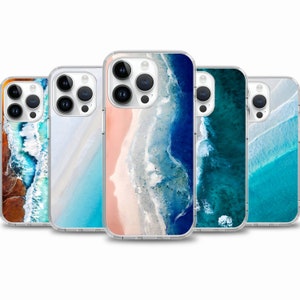 May include: Five clear phone cases with different beach-themed designs. The cases feature images of ocean waves, sand, and blue water.