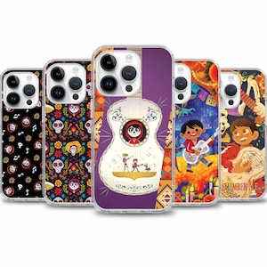 May include: Five different phone cases featuring designs from the Disney Pixar movie Coco. The cases feature a guitar, a skull, and a colorful pattern. The text "Remember Me" is visible on one of the cases.