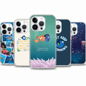May include: Five different phone cases featuring characters from the animated movie Finding Nemo. The cases are all clear and show different images of the characters, including Dory, Marlin, and Nemo. The text on the cases reads "When something is too hard, there is always another way", "I look at you and I'm home", and "Just keep swimming".