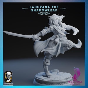May include: A grey 3D printed miniature of a female figure with long hair, wearing a long coat and holding a sword. The figure is posed in a dynamic action pose, with one leg raised and the sword held out in front of her. The miniature is titled "Lahurana the Shadowleaf".