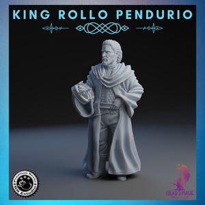 May include: A light grey figurine of a man in a long coat, holding a circular object. The figure has a beard and is standing. The text "KING ROLLO PENDURIO" is at the top. Logos for "Premium Resin Studio" and "Mead3Magic" are in the corners.