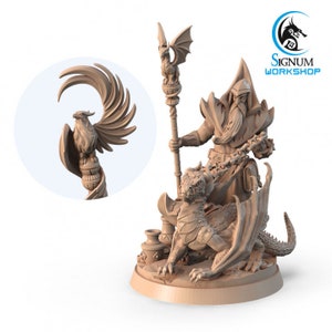 May include: A detailed miniature figurine of a wizard with a long white beard, wearing a hooded robe and holding a staff topped with a phoenix. The wizard is seated on a small dragon with wings outstretched. The figurine is painted in a light brown color.