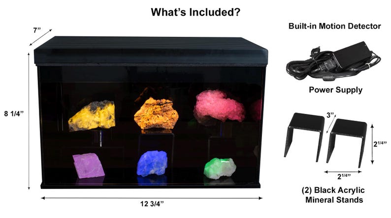 May include: A black acrylic display case with a built-in motion detector, power supply, and two black acrylic mineral stands. The case is 12 3/4 inches wide, 8 1/4 inches tall, and 7 inches deep. The case has a clear glass front and a black interior. The case is lit from the inside and has a black top.