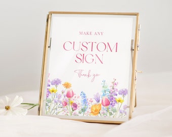 May include: Gold-framed sign with a white background and floral border. The text reads "Make any Custom Sign Thank you".