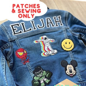 May include: A denim jacket with various embroidered patches, including a smiley face, Spider-Man, Hulk, Mickey Mouse, and an astronaut on a skateboard. The name "ELIJAH" is stitched across the back. Text on the jacket reads "PATCHES & SEWING ONLY".