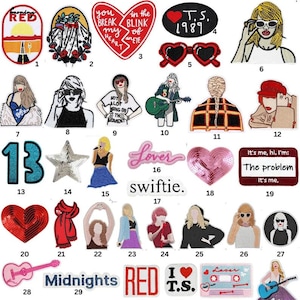 May include: Collection of iron-on patches and enamel pins featuring various designs. Includes patches with text like "RED", "Lover", and "Midnights", along with images of a guitar, sunglasses, and a star. Also includes enamel pins.