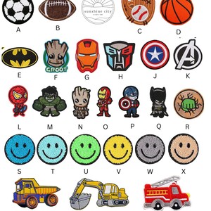 May include: A collection of embroidered patches featuring sports equipment, cartoon characters, and smiley faces. Includes a soccer ball, football, baseball glove, basketball, Batman logo, Groot, Iron Man, and a Transformers logo.