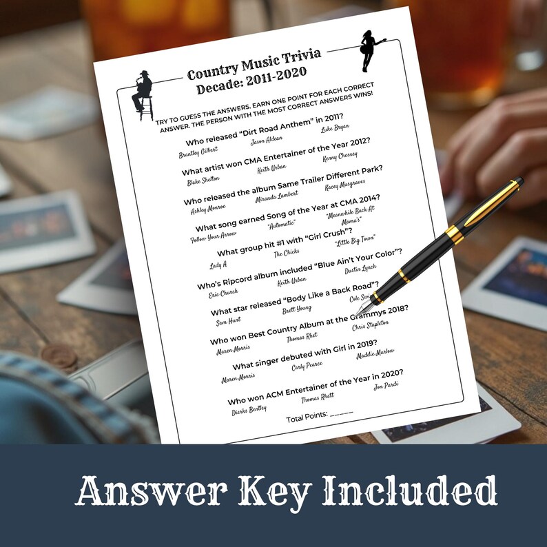 May include: A black and white trivia game sheet titled "Country Music Trivia Decade: 2011-2020" with a gold and black pen resting on it. The sheet includes questions about country music artists and songs. The text "Answer Key Included" is at the bottom.