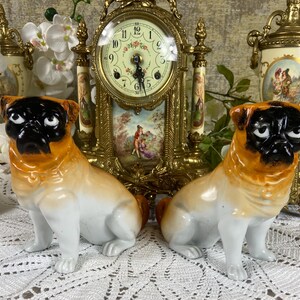 An Antique Pug Dog figurines