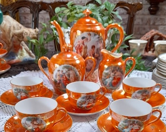 May include: A vintage orange and gold tea set with a floral design. The set includes a teapot, creamer, sugar bowl, and six teacups and saucers.