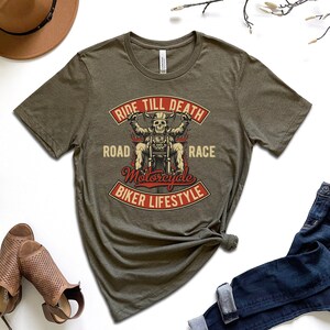 May include: A green t-shirt with a graphic of a skeleton riding a motorcycle. The graphic says "Ride Till Death Road Motorcycle Race Biker Lifestyle".
