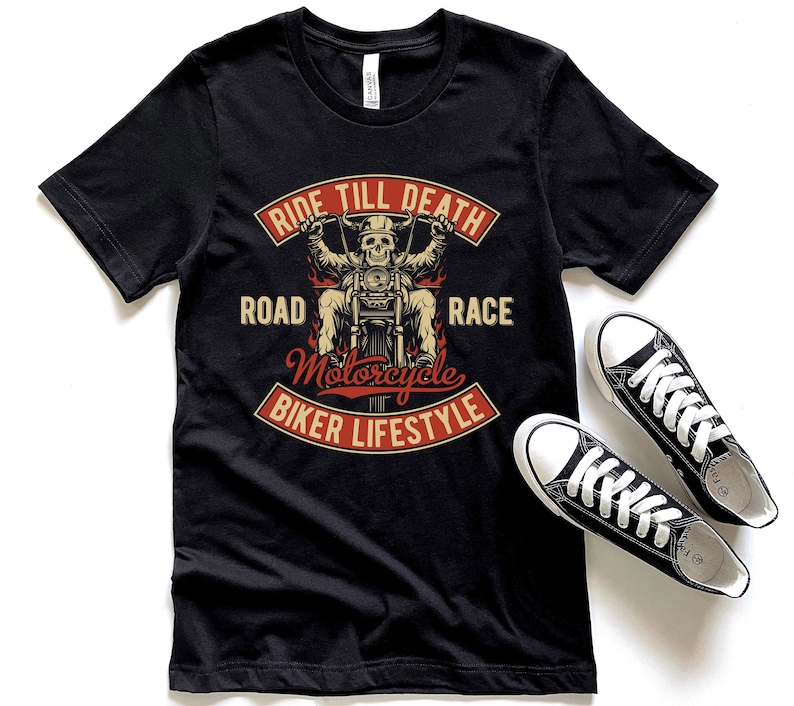 May include: Black t-shirt with a graphic of a skeleton riding a motorcycle. The graphic includes the text "Ride Till Death Road Motorcycle Race Biker Lifestyle".