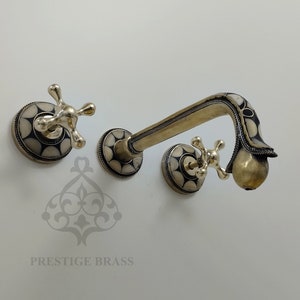 Wall mounted brass bathroom faucet accented with resin and bone-in accents, Unlacquered Brass Bath Faucet