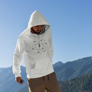 May include: White hooded sweatshirt with a black and white graphic of a disc golf basket inside an atom symbol.