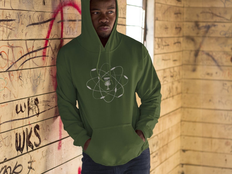 May include: A green hooded sweatshirt with a white graphic of a disc golf basket inside an atom symbol.