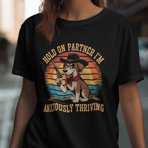 Hold On Partner T-Shirts, Anxiously Thriving Cowboy Dog T-Shirts, Funny Western T-Shirts, Cartoon Dog T-Shirts, Trendy Graphic Tees