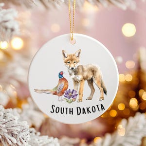 Decorazione natalizia del South Dakota: uccello, fiore e coyote dello stato