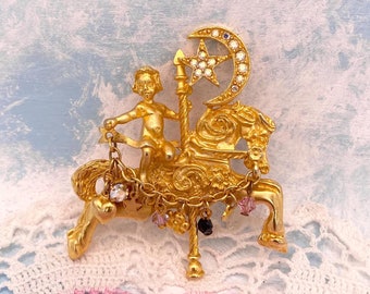 Kirk&#39;s Folly Cherub Riding Carousel Horse Under Crescent Moon & Star Crystal Charm Brooch