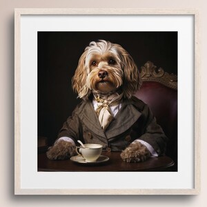 May include: A brown and white dog wearing a brown jacket and a white cravat sits in a chair with a cup of tea and saucer on a wooden table.
