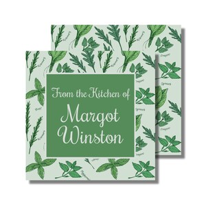 May include: Green square label with a white background and a green border. The label has a green rectangle in the center with the text "From the Kitchen of Margot Winston". The background is a pattern of various herbs and spices.