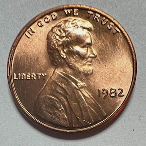 1982 large date copper Lincoln head penny uncirculated condition with original luster. The  coin you see is the coin you’ll receive. LU1