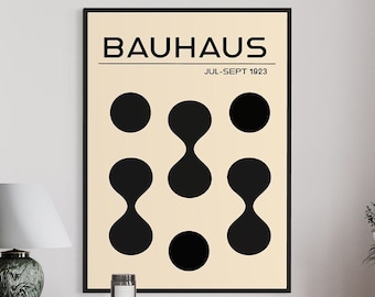 May include: A black and white poster with the text "Bauhaus Jul-Sept 1923" and a design of black circles and ovals on a light beige background.