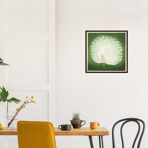 May include: A framed print of a white peacock with its tail feathers spread out against a green background.