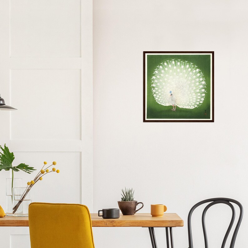 May include: A framed print of a white peacock with its tail feathers spread out against a green background.