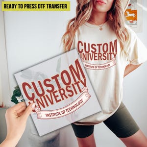 May include: A beige t-shirt and a square print featuring the text "CUSTOM UNIVERSITY INSTITUTE OF TECHNOLOGY" in maroon. The t-shirt has the same design. The words "READY TO PRESS DTF TRANSFER" are at the top.