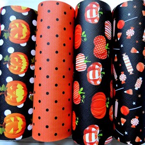 May include: Four rolls of black and orange patterned fabric with Halloween themes. The patterns include jack-o'-lanterns, candy corn and candy canes.