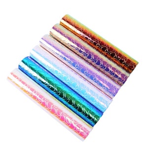 May include: A set of seven iridescent vinyl sheets with a heart pattern. The sheets are in various colours, including pink, blue, purple, and gold.