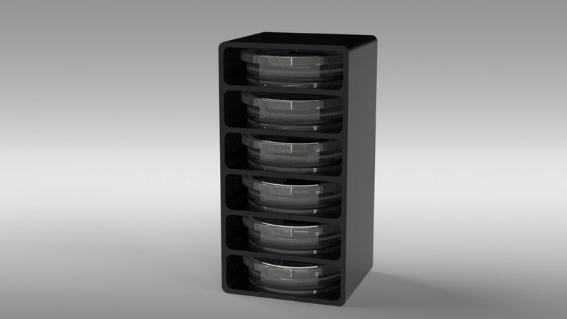 May include: A black storage unit with five compartments, each holding a clear, round container. The unit has a sleek, modern design, and the containers appear to be made of glass or clear plastic. The overall aesthetic is minimalist and functional.
