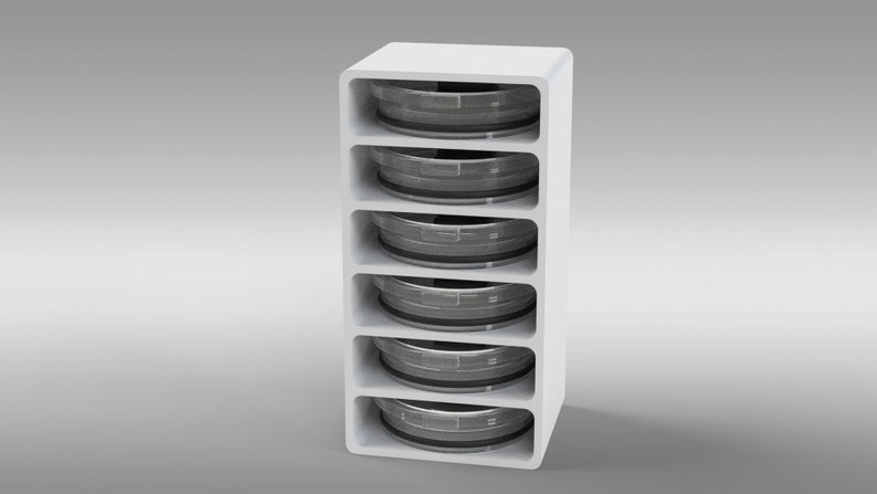 May include: A white, vertical storage unit with five open compartments, each holding a circular, gray object. The unit has rounded edges and a minimalist design, suitable for organizing items.