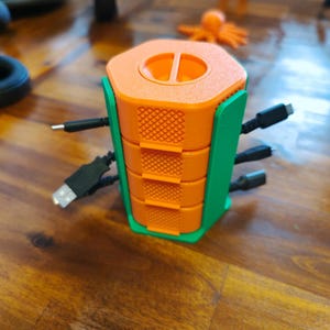 Soporte para organizador/enrollador de cables portátil