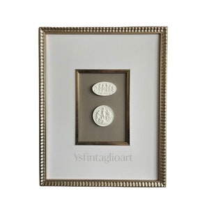 Framed Grand Tour Intaglios against a taupe textured background in a 11x14 gold scalloped frame
