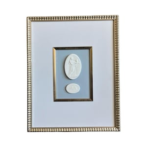 Framed Grand Tour Intaglios against a sky blue textured background in a 11x14 gold scalloped frame