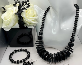 Black necklace w/ silver accents; Women's costume jewelry set w/ cylinder shaped black beads (4-piece set  - necklace, bracelet, 2 earrings)