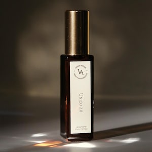 May include: A brown glass bottle of oil perfume with a gold cap. The label reads "Verdis Atelier VA Beauty in Expression Unico 2.0 oil perfume 10ml / 0.33oz."