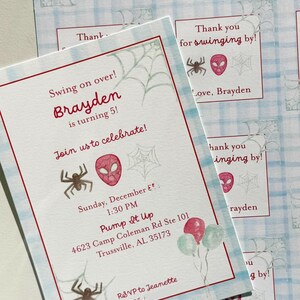 May include: Invitations for a child's birthday party. The invitation features a red and white border, with the text "Swing on over! Brayden is turning 5!" and event details. Spider-Man mask and spider web illustrations are included.