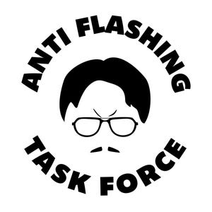 May include: A black and white graphic featuring a stylized face with glasses, a mustache, and a circular design. The words "ANTI FLASHING TASK FORCE" are in a circular arrangement around the face.