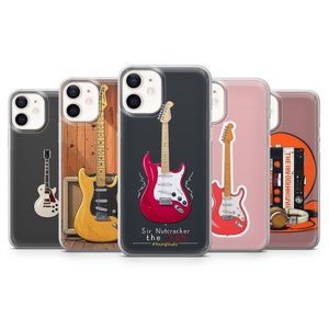 May include: Set of five phone cases featuring different illustrations of electric guitars. The cases are clear and show the phone screen through the back. One case features a red electric guitar with the text "Sir Nutcracker the 5th #YoungSkullly".
