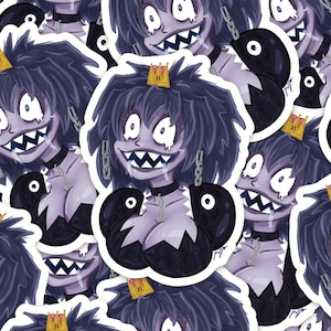 May include: A repeating pattern of stickers featuring a purple and black cartoon character with a crown, a toothy grin, and a chain necklace. The character is holding two black spheres. The stickers are on a white background.