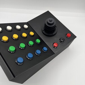 Rear, top view of button box controller showing solid black casing.