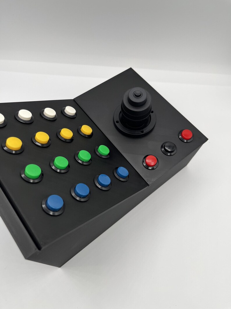 Rear, top view of button box controller showing solid black casing.