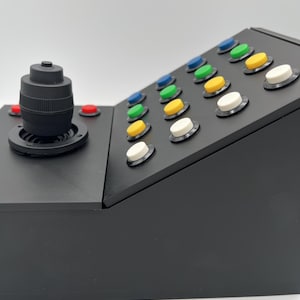 Close up side view of the top portion of the farming simulator button box.